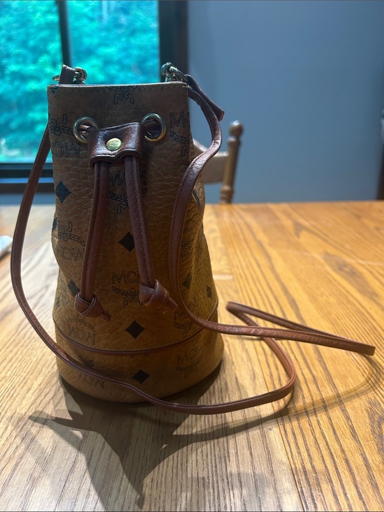 MCM Handbags - MCM Cognac Brown Monogram Leather Drawstring Mini Bucket Bag